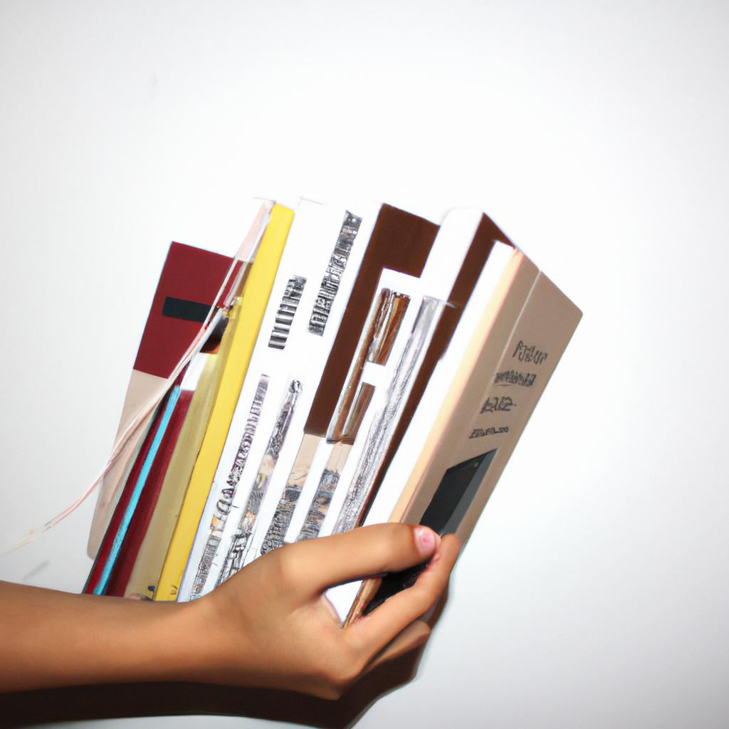 Person holding design books, curating